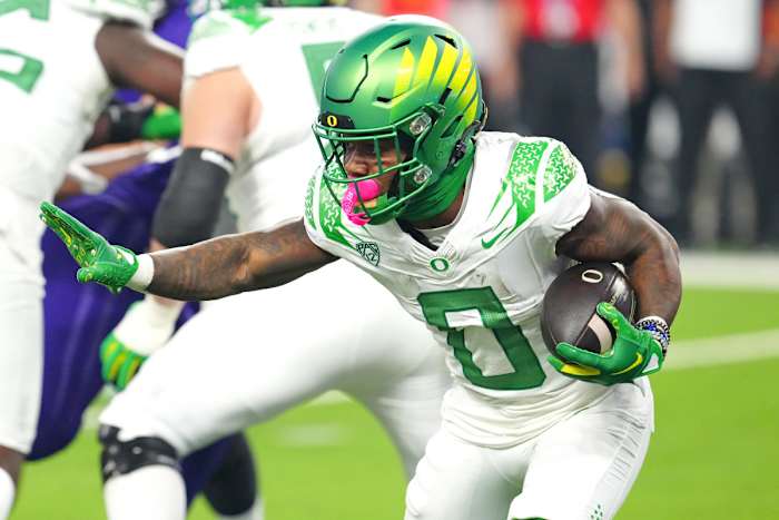 Oregon Ducks running back Bucky Irving rushes against the Washington Huskies in the Pac-12 Championship.